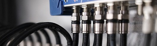 Coaxial cables plugged in to device