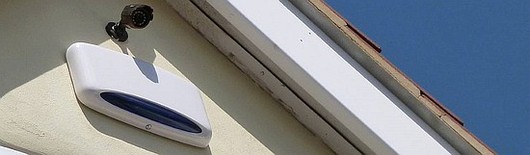 Alarm systems on an exterior house wall