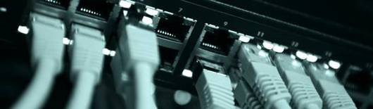 RJ45 sockets with cables coming out on a patch panel